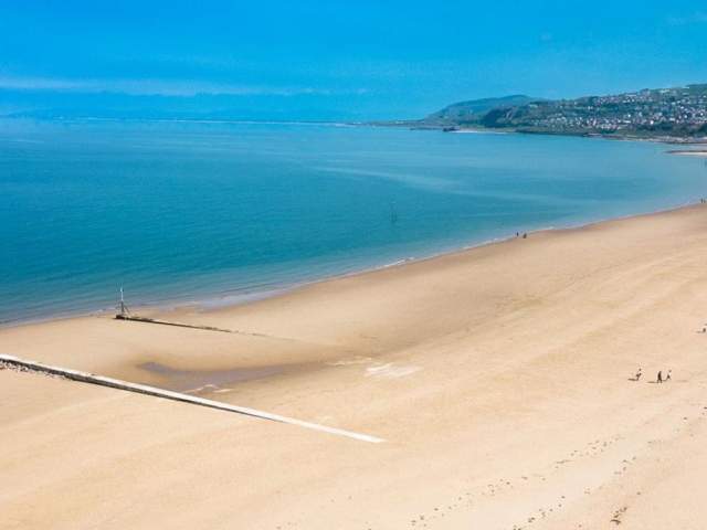 View of the sea and beach at Rhos on Sea