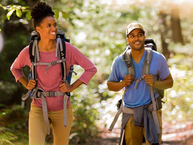 Couple with backpacks hiking the Appalachian Trail