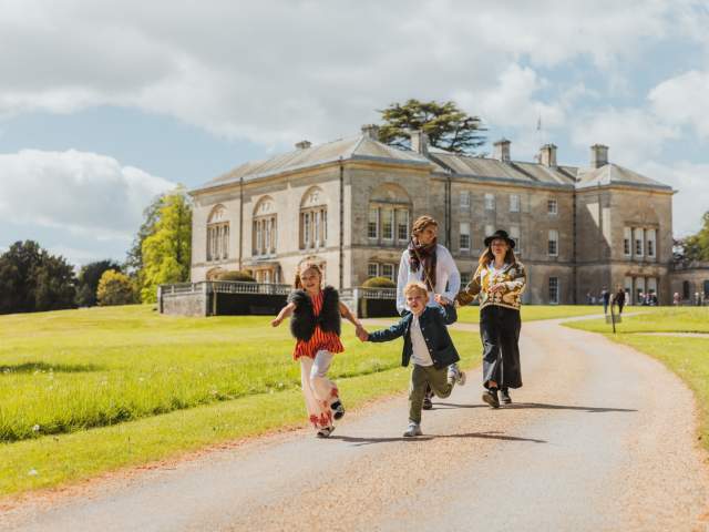 A family walking outside Sledmere House