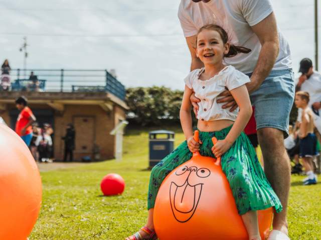 A little girl on a space hopper at the Withernsea Pirate Festival in East Yorkshire.