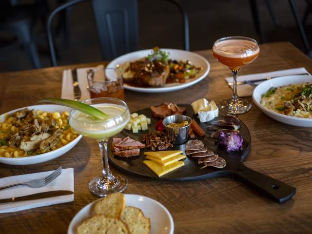 Dining Table Full of Food at Three Rivers Distilling Company in Fort Wayne, Indiana for Savor Fort Wayne