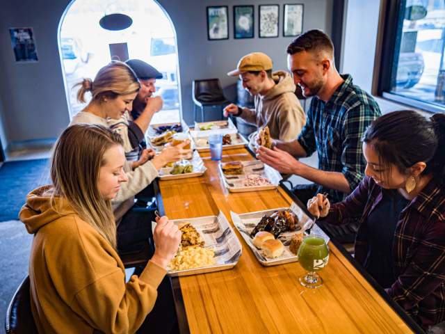 Friends eating at 2Toms Brewing Company