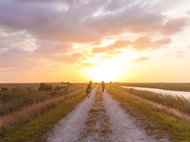 People walking along Atlantic Trailhead path near Coral Springs