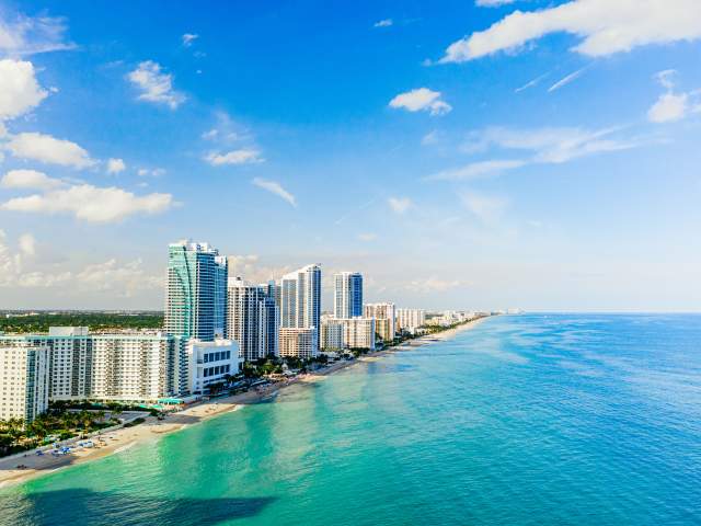 Aerial view of Hallandale Beach and buildings at the shoreline