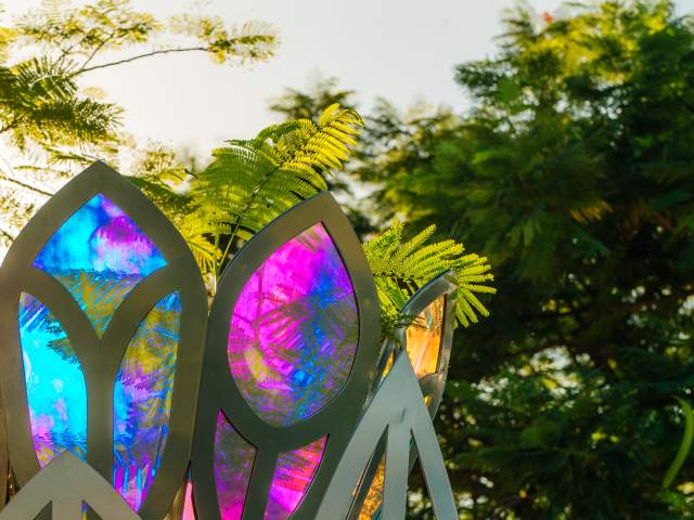 Sunlight sparkles on a sculpture featured at Ilene Lieberman Botanical Gardens in Lauderhill Florida