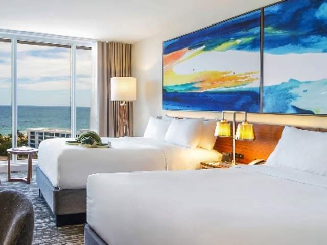 Interior of an oceanfront room with double beds at B Ocean hotel in Fort Lauderdale