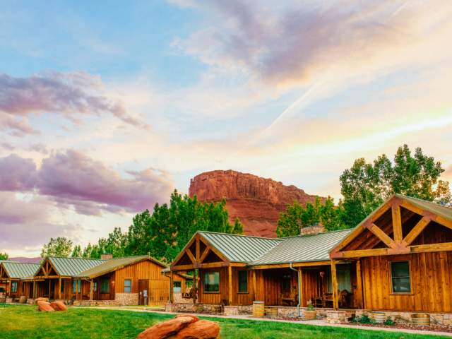 Luxury log-cabin accommodations at the Sorrel River Ranch Resort & Spa, nestled along the Colorado River near Moab, Utah.
