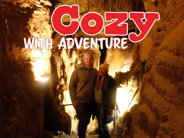 A couple stands in front of a formation in Lincoln Caverns