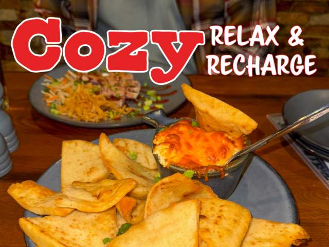 a plate of crab dip and pita bread