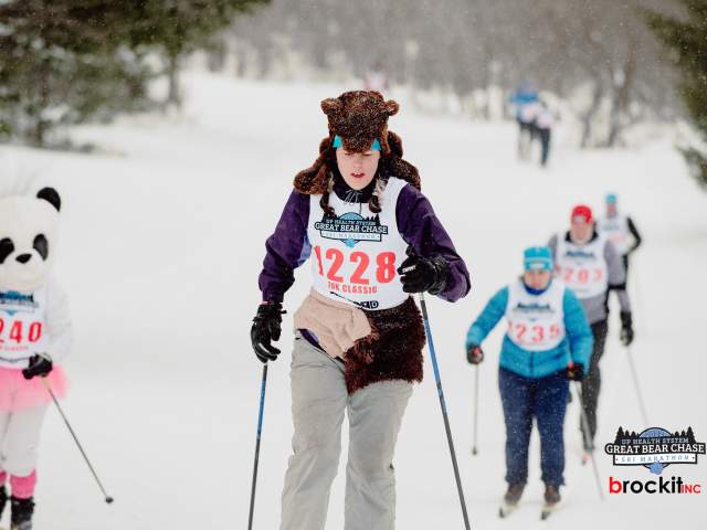 skiers wear plush bear hats while they race
