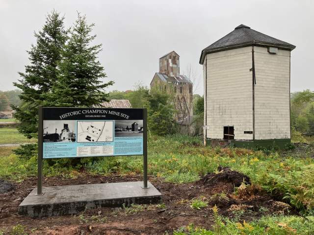 A sign explaining the history of the area's mining