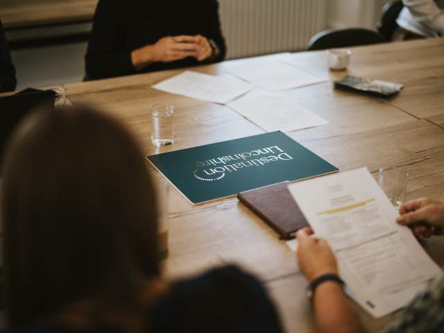 a table top image with a sign that reads 'Destination Lincolnshire'