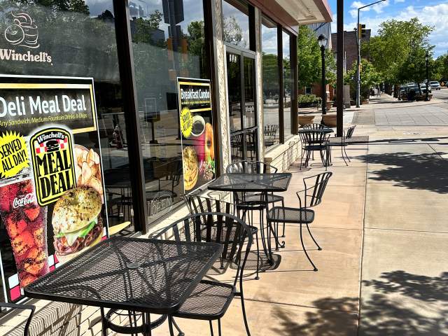 patio seating in front of Winchell's Donuts