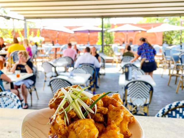 Plate of food with patio in the background