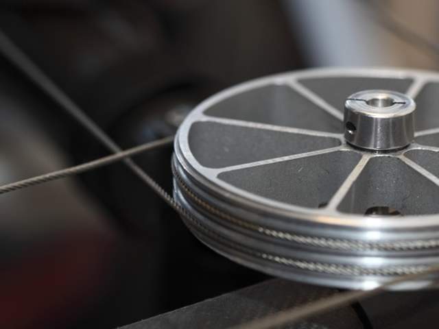 A steel pulley on a blurred background