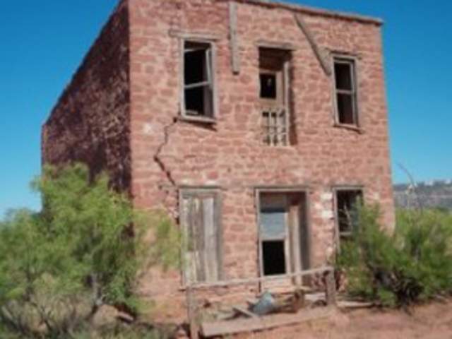 A brick house in the ghost town of Montoya, NM