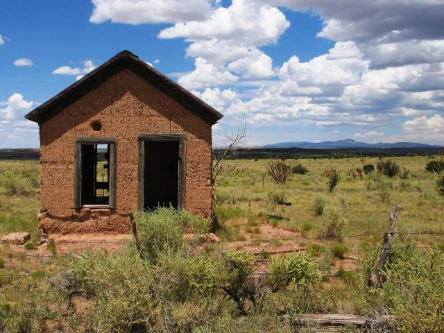 Small Abandoned Building On A Prairie