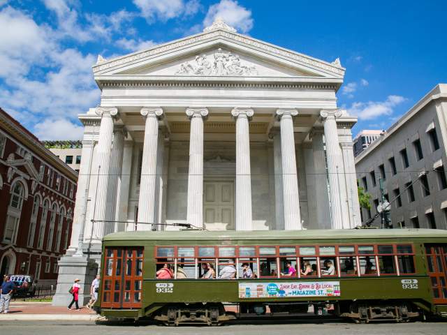 A Streetcar Passes in front of Gallier Hall