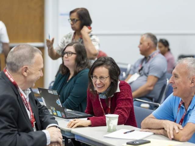 meetings boardroom laughter professionals - Photo cred to laurie dewitt