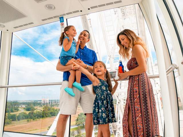 ICON Park family in capsule of The Wheel