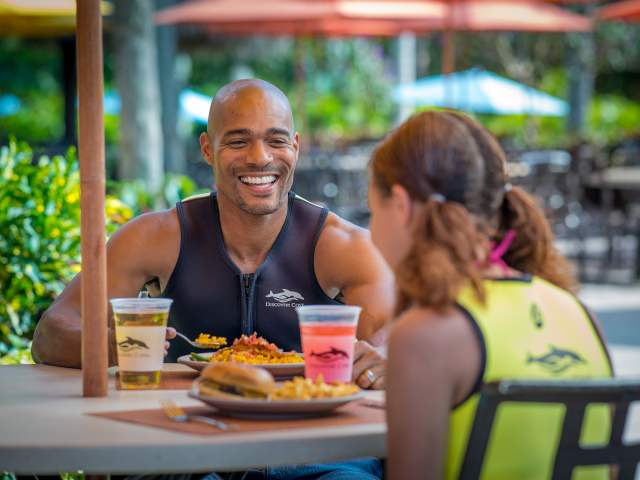 A couple eating at Discovery Cove Laguna Grill