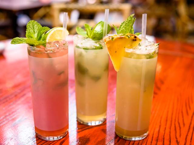 Three colorful mojitos in a row at Cuba Libre Restaurant & Rum Bar