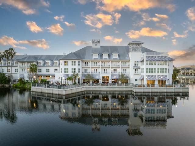 The Inn at Celebration exterior and lake at dusk