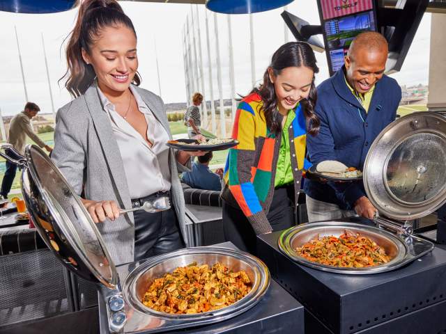 People at event buffet at Topgolf