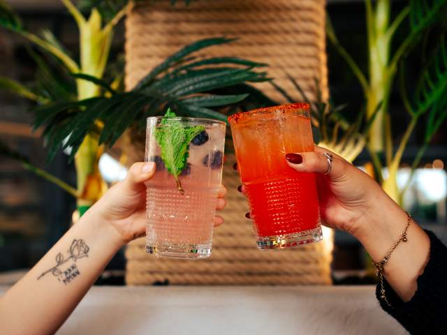 Toasting drinks at Palm Tree Club