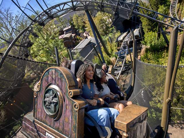 Guests spin and soar on Curse of the Werewolf, a unique spinning roller coaster in Dark Universe at Universal Epic Universe