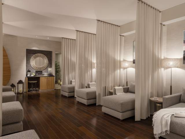 Eforea Spa lounge are with comfortable seating and privacy curtains at Hilton Orlando