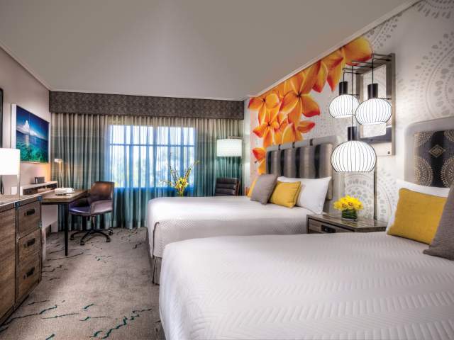 Loews Royal Pacific Resort at Universal Orlando™ bedroom with two queen beds
