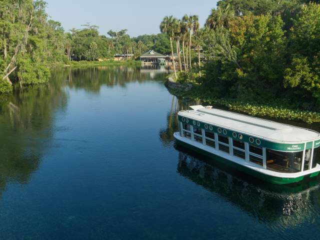 A glass-bottomed boat floats across the water at Silver Springs State Park
