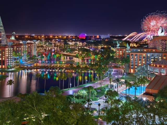 Night resort overview with fireworks of Walt Disney World Swan and Dolphin Resort