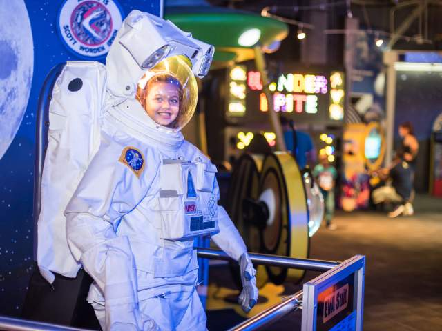 WonderWorks girl in astronaut suit