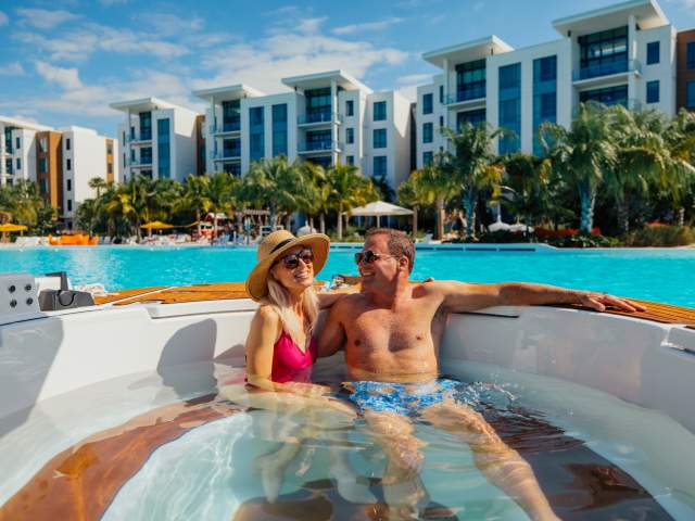 Couple Cruising Bay in Spa Cruisy Boat