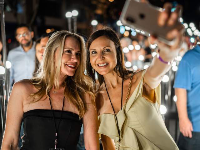 Women taking a selfie at Immerse 2025