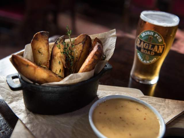 Basket of fries and a glass of beer at Raglan Road Irish Pub