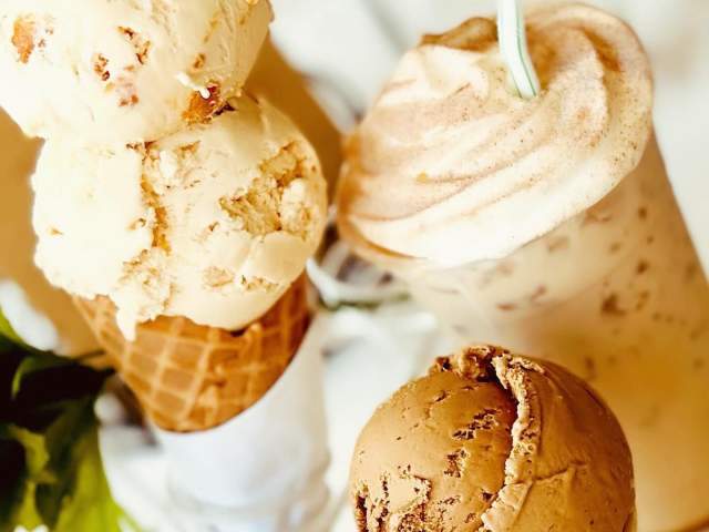 Ice cream cones and a milkshake on a table