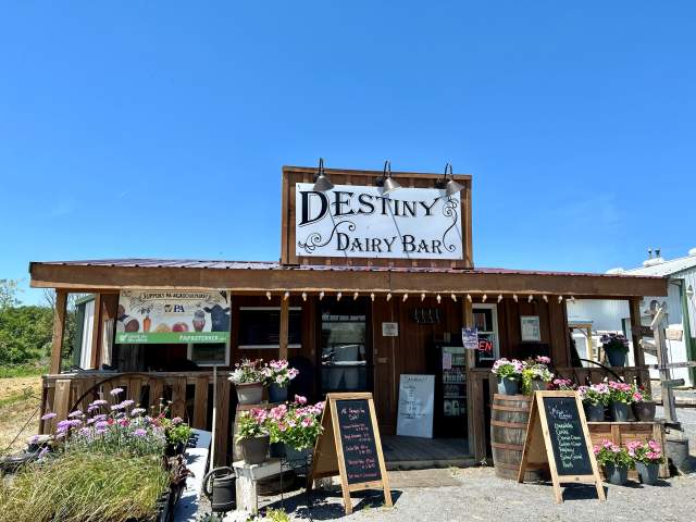 Exterior of an ice cream shack with a sign that reads Destiny Dairy Bar