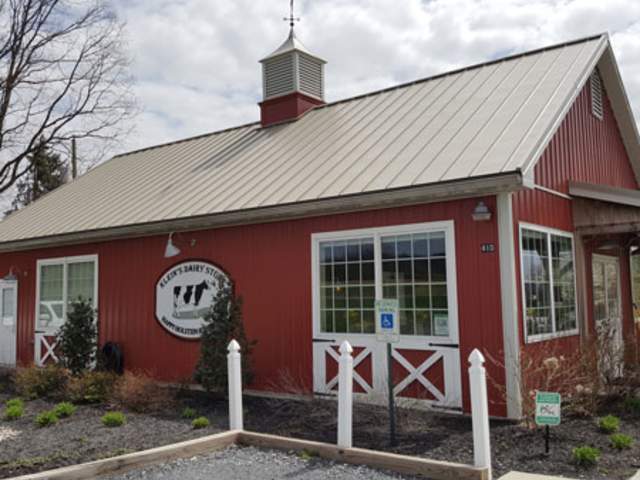 Exterior of a red, cabin-like ice cream shack
