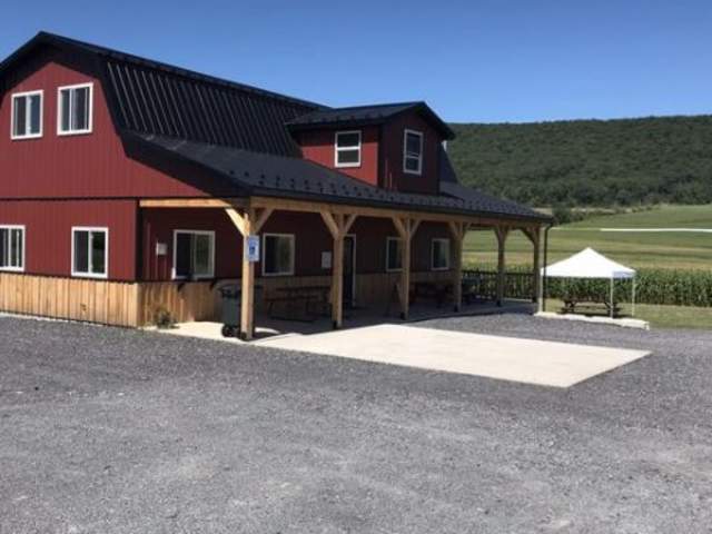 Exterior of a red farm-like ice cream shop