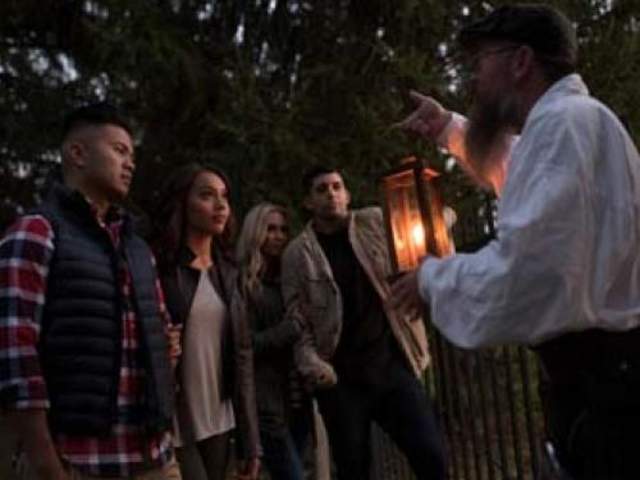 Group of people outside at night