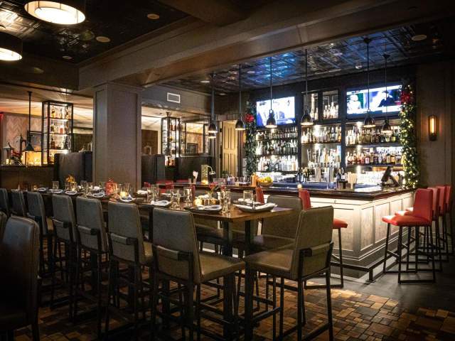 A restaurant and bar with tables and chairs