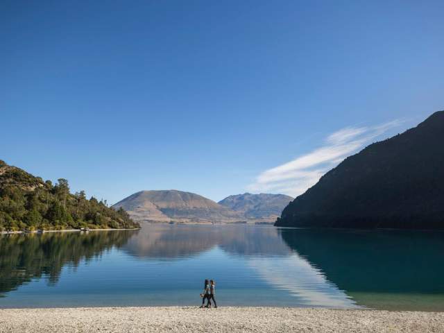 Lake with reflection of clear sky and mountains