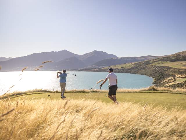Friends golfing at Jacks Point Course in Summer