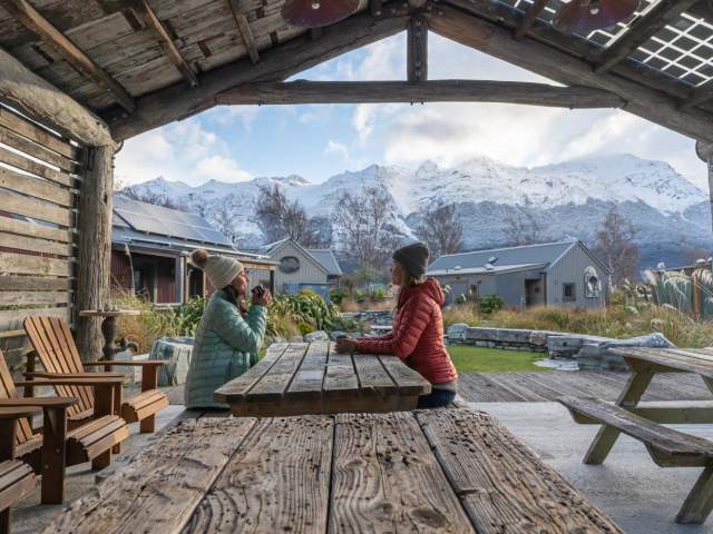 Guests enjoying a hot drink at Headwaters Eco Lodge, Glenorchy