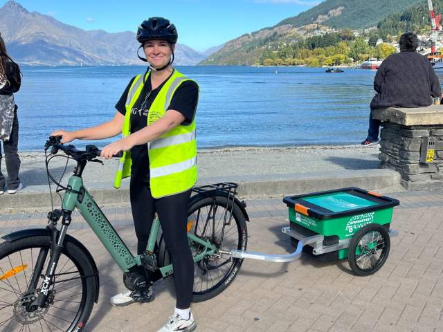Katie Robertson on an e-bike as a food rescue volunteer for KiwiHarvest