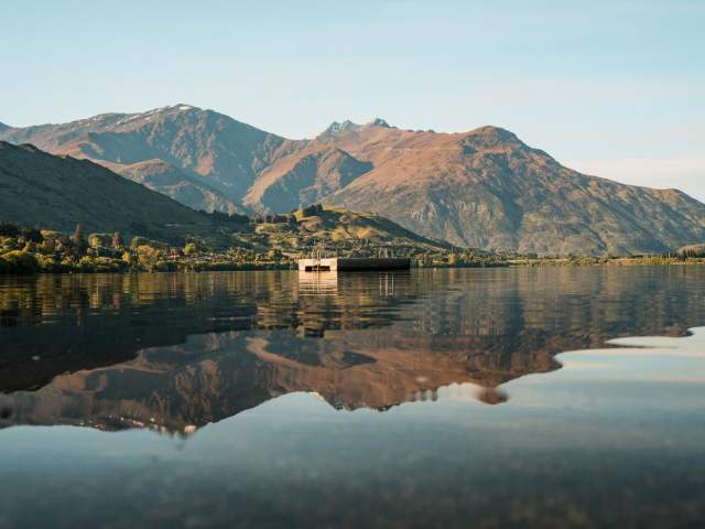Mountains reflected on still lake