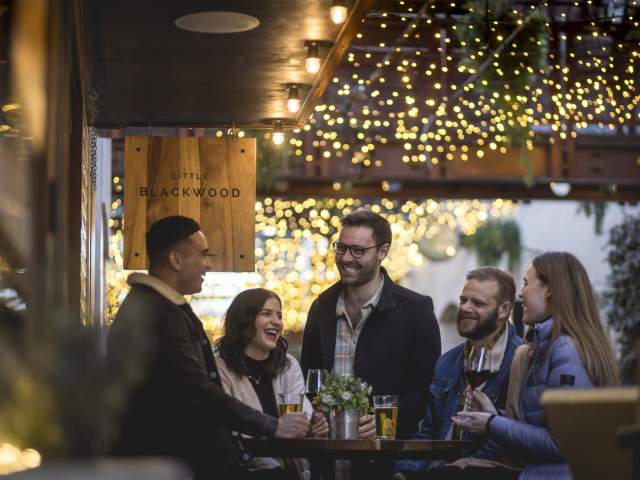 Friends enjoying drinks at Little Blackwood